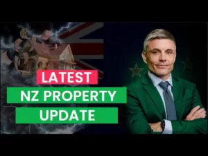 A man looking into the camera with his arms crossed with text next to him "Latest NZ Property Update"