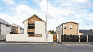 2 houses in New Zealand next to each other. This is a picture for a blog post about investment property in NZ