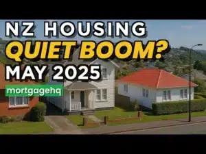 Houses in NZ with text on top "NZ housing quiet boom? May 2025"