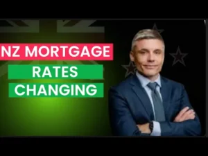 A man looking at the camera with his arms crossed with text next to him "NZ mortgage rates changing"